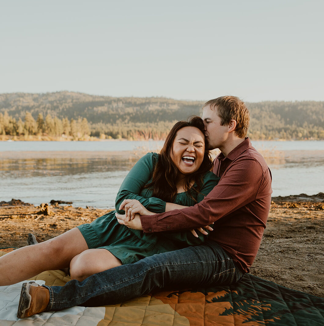 couple laughing while being captured by big bear lake photographer